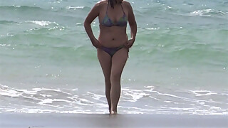 My mature wife shows off and enjoys the beach with her lover